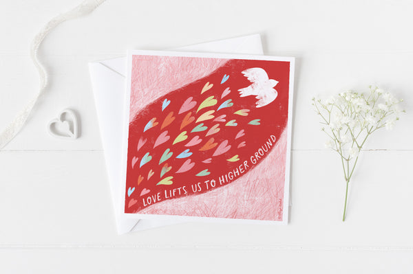 5x5 valentines card by Eliza Todd featuring a dove and colorful hearts, saying "Love lifts us to higher ground." - APeaceofWerk.com