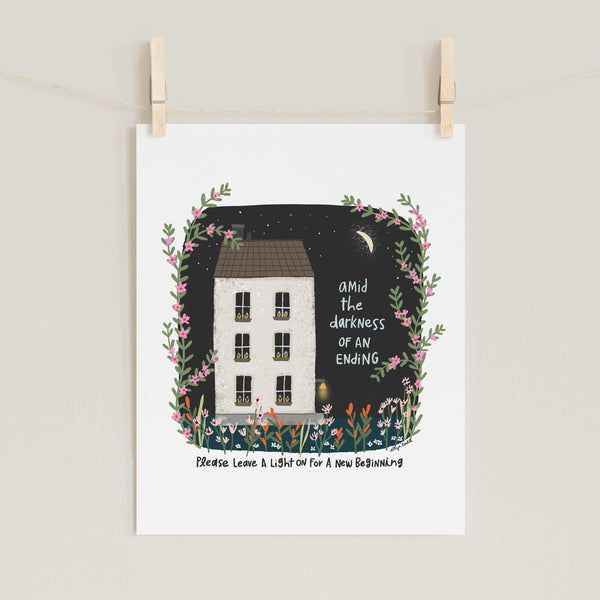 Fine art prints by Eliza Todd featuring a white house at night with the front porch light on saying "Amid the darkness of an ending, please leave a light on for a new beginning." - APeaceofWerk.com