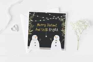 5x5 holiday card by Eliza Todd featuring two smiling snowmen, saying "Merry, distant and still bright." - APeaceofWerk.com